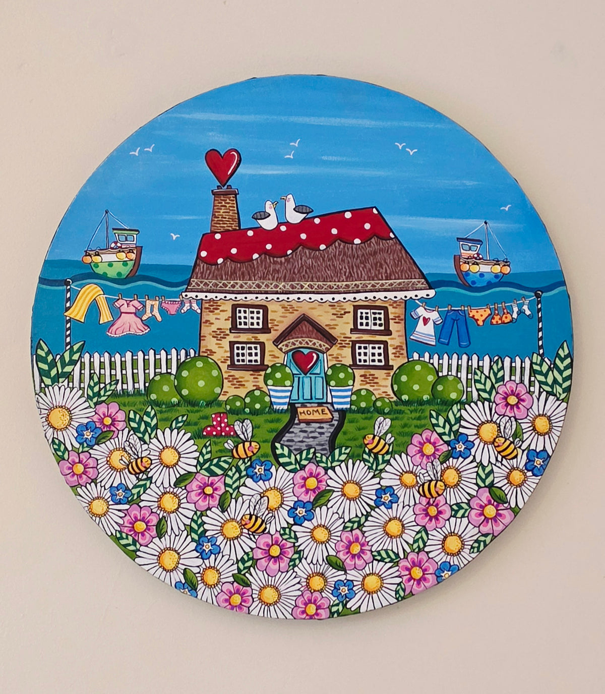 Cute little cottage by the sea circle canvas